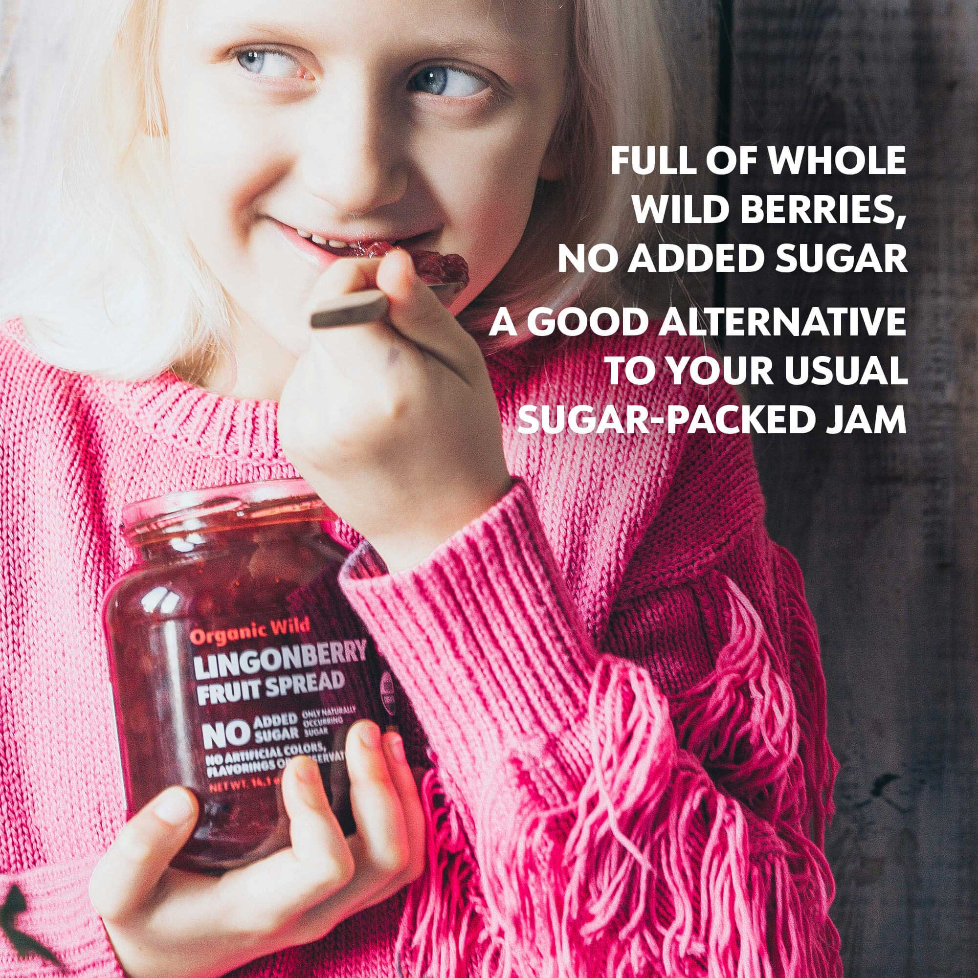 Girl eating from a jar of lingonberry fruit spread