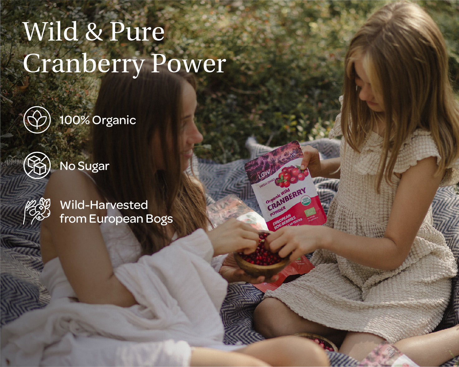 “A stand-up pouch of LOOV Freeze-Dried Organic Wild Cranberry Powder, with white and deep red packaging showing fresh cranberries on the front. A small mound of vibrant red powder sits in front of the bag.”