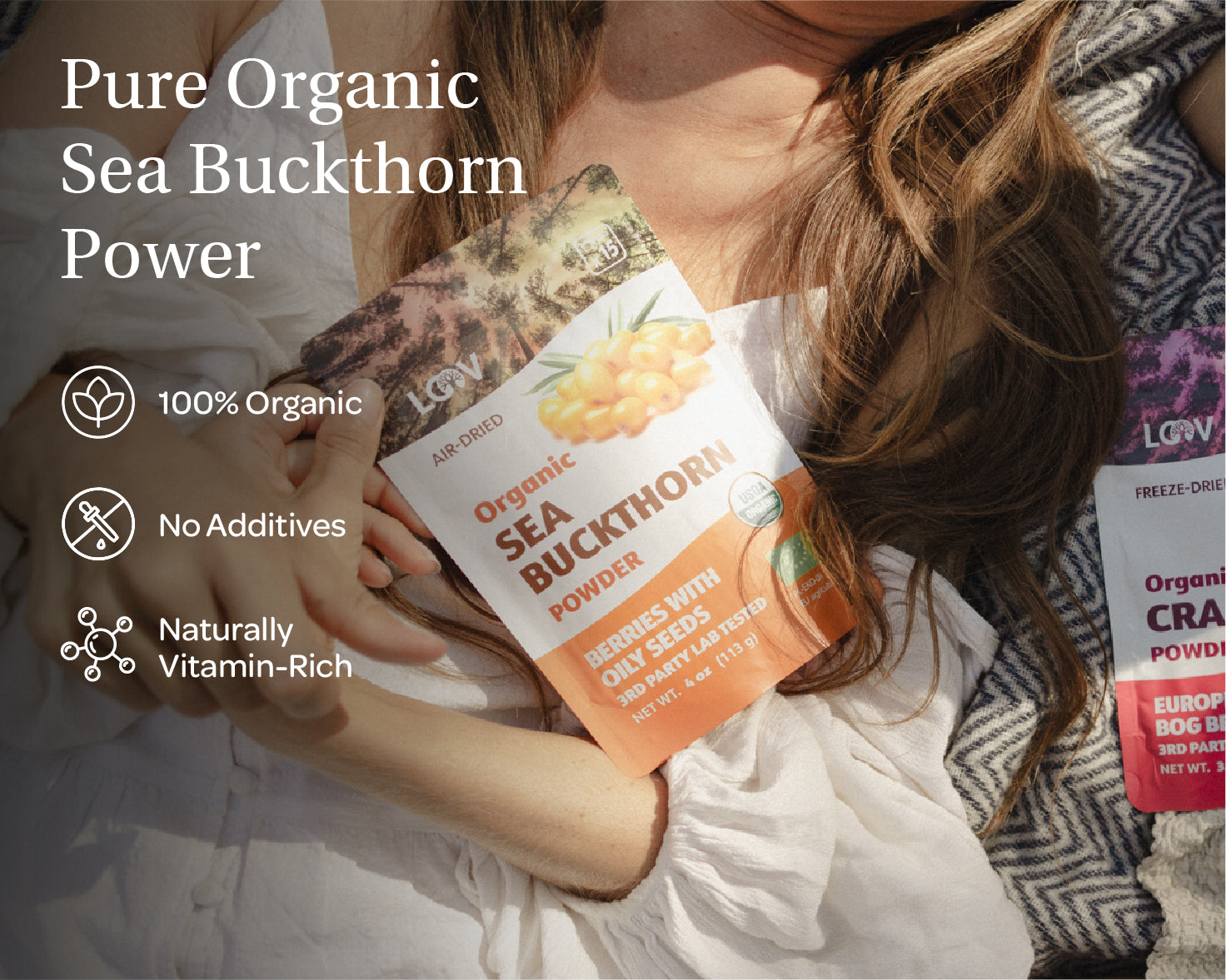 “A stand-up pouch of LOOV Organic Sea Buckthorn Powder, air-dried. The packaging shows images of bright orange sea buckthorn berries and has a white and orange label with 'Organic Sea Buckthorn Powder' text, along with green organic certification seals. A small mound of the powder is shown in front of the pouch.”