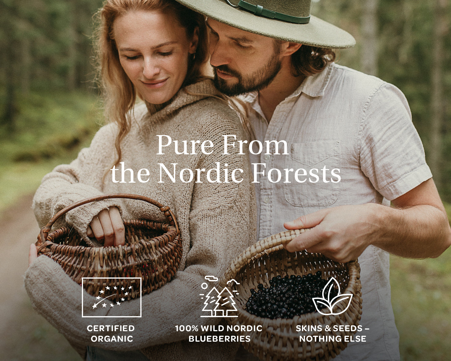 A couple in a lush forest, sharing baskets of blueberries. The text reads, 