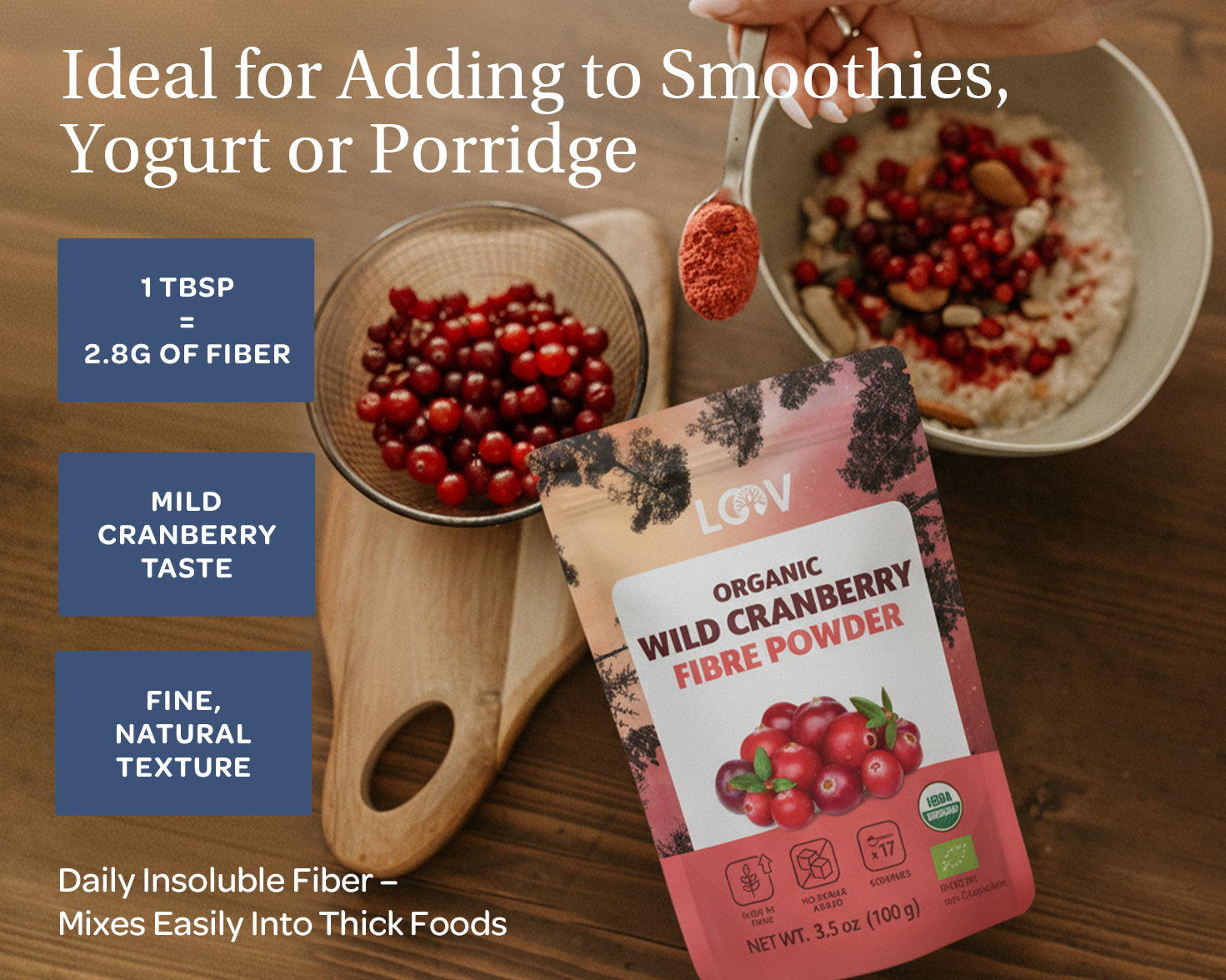 Package of LOOV organic wild cranberry fiber powder on a table with a bowl of cranberries and porridge. Text highlights its use in smoothies and yogurt.
