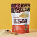 “A stand-up pouch of LOOV Organic Non-fortified Nutritional Yeast Flakes with white and orange packaging. The label reads ‘Organic Nutritional Yeast Flakes Non-Fortified’ and shows a small pile of pale yellow yeast flakes in front.”