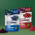 “Two LOOV stand-up pouches side by side labeled ‘Organic Wild Blueberry Powder’ (blue/white) and ‘Organic Wild Cranberry Powder’ (red/white), with images of blueberries and cranberries on the packaging.”