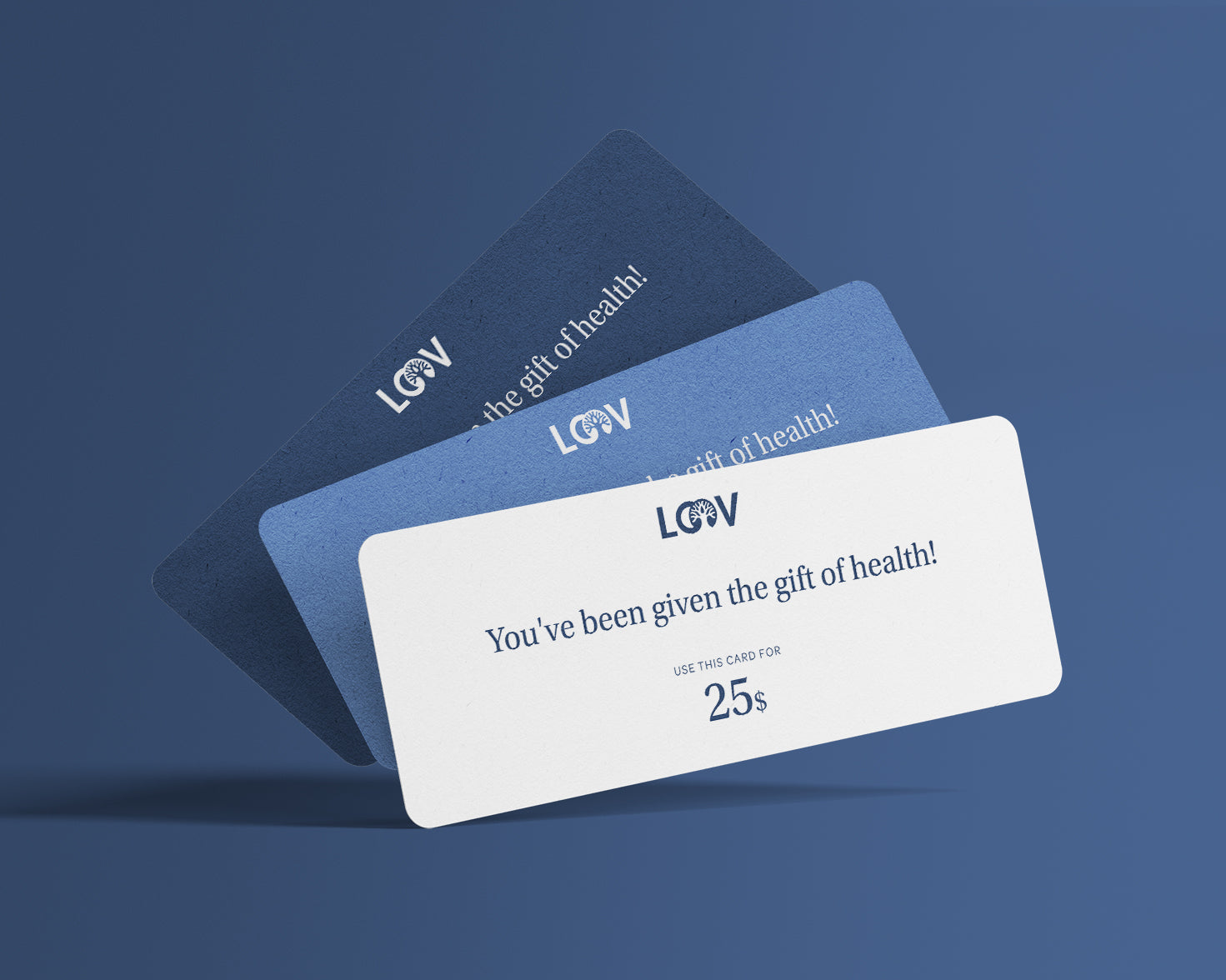 “An elegant gift box labeled ‘Gift of Health’ from LOOV, featuring natural tones and green accents, with illustrations of leaves and fruits, containing assorted LOOV products (such as bottles and pouches) partially visible inside.”