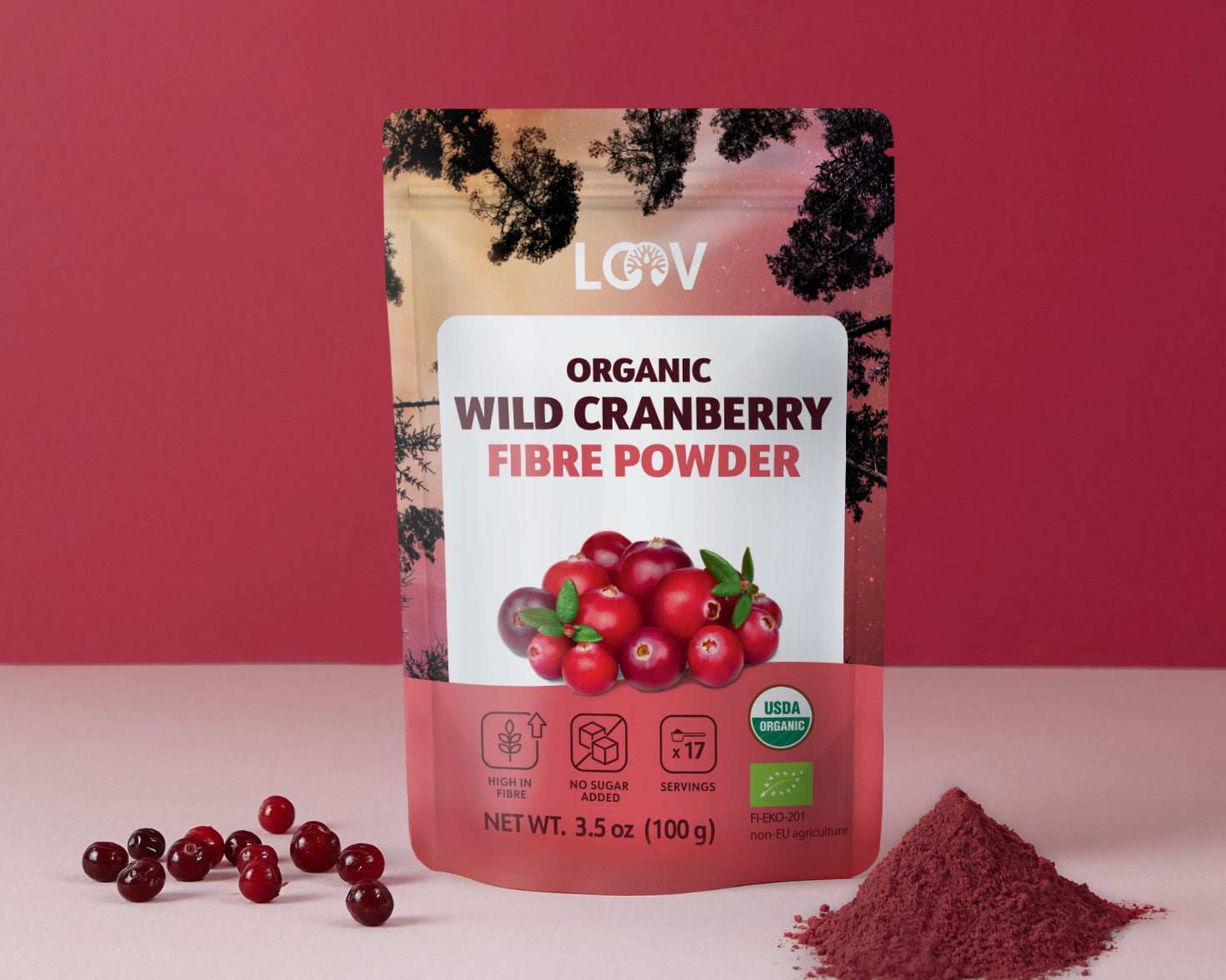 Packaging of LOOV Organic Wild Cranberry Fibre Powder against a pink background. Fresh cranberries and a pile of cranberry powder are beside it, conveying a natural and organic vibe.